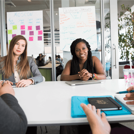 People meeting at work around a table